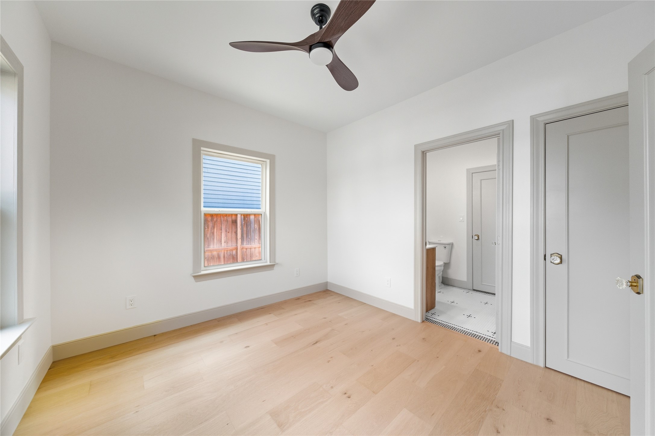 1202 Aurora Street Houston, TX 77009 - Photo 17 of 37 a view of an empty room with a window