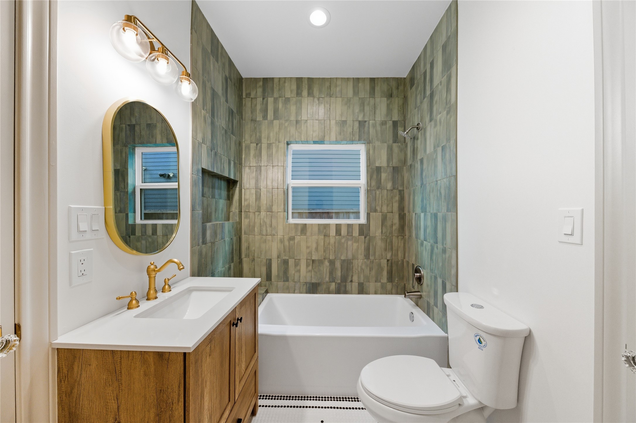 1202 Aurora Street Houston, TX 77009 - Photo 18 of 37 a bathroom with a sink a toilet and shower