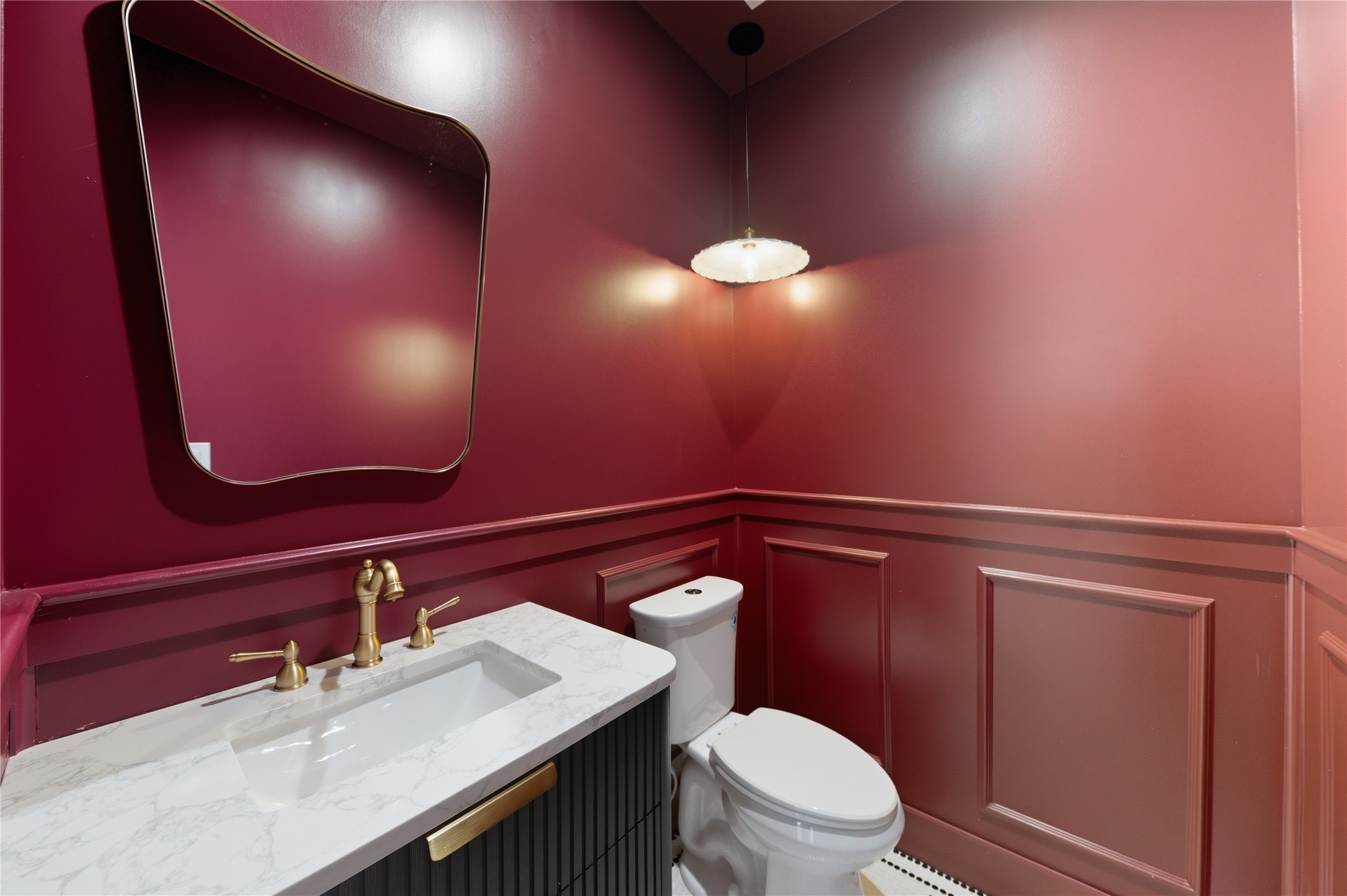 1202 Aurora Street Houston, TX 77009 - Photo 23 of 37 a bathroom with a sink vanity and a toilet