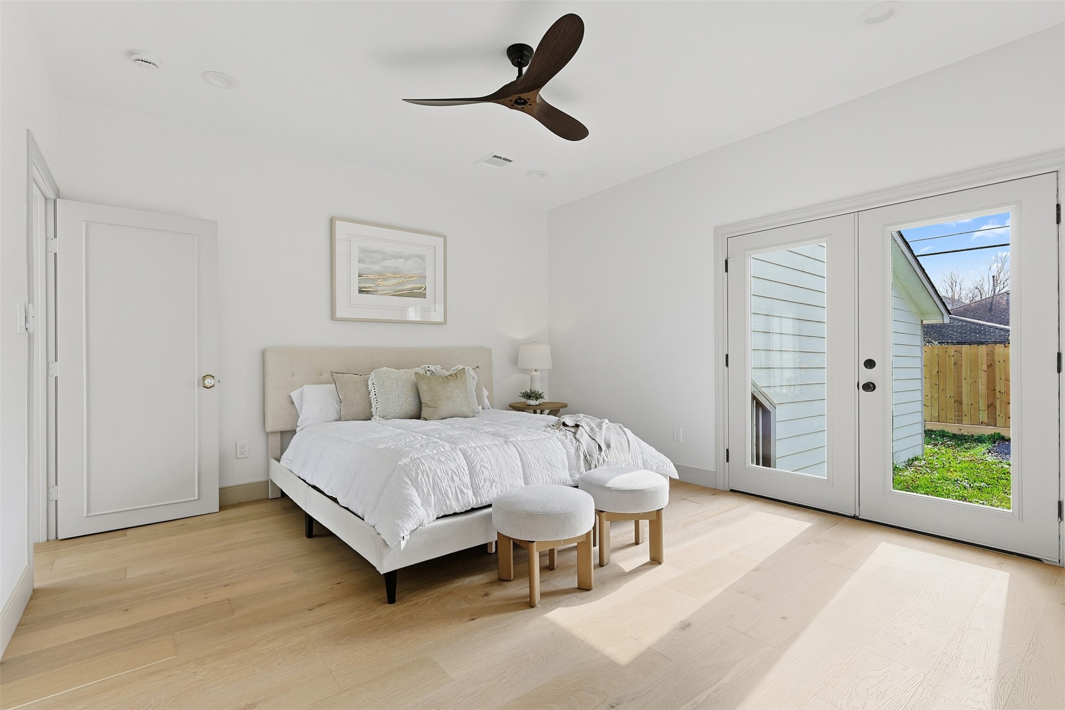 1202 Aurora Street Houston, TX 77009 - Photo 26 of 37 a spacious bedroom with a bed and a chandelier