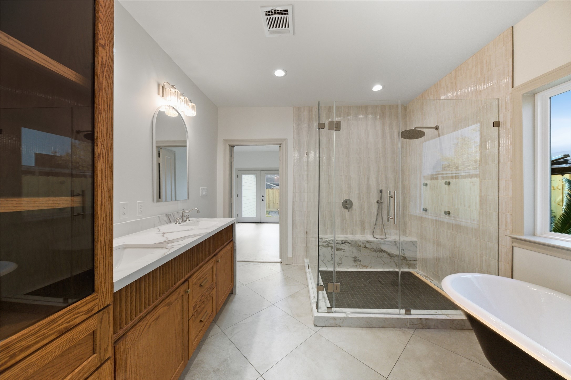 1202 Aurora Street Houston, TX 77009 - Photo 30 of 37 a bathroom with a granite countertop tub sink shower and mirror