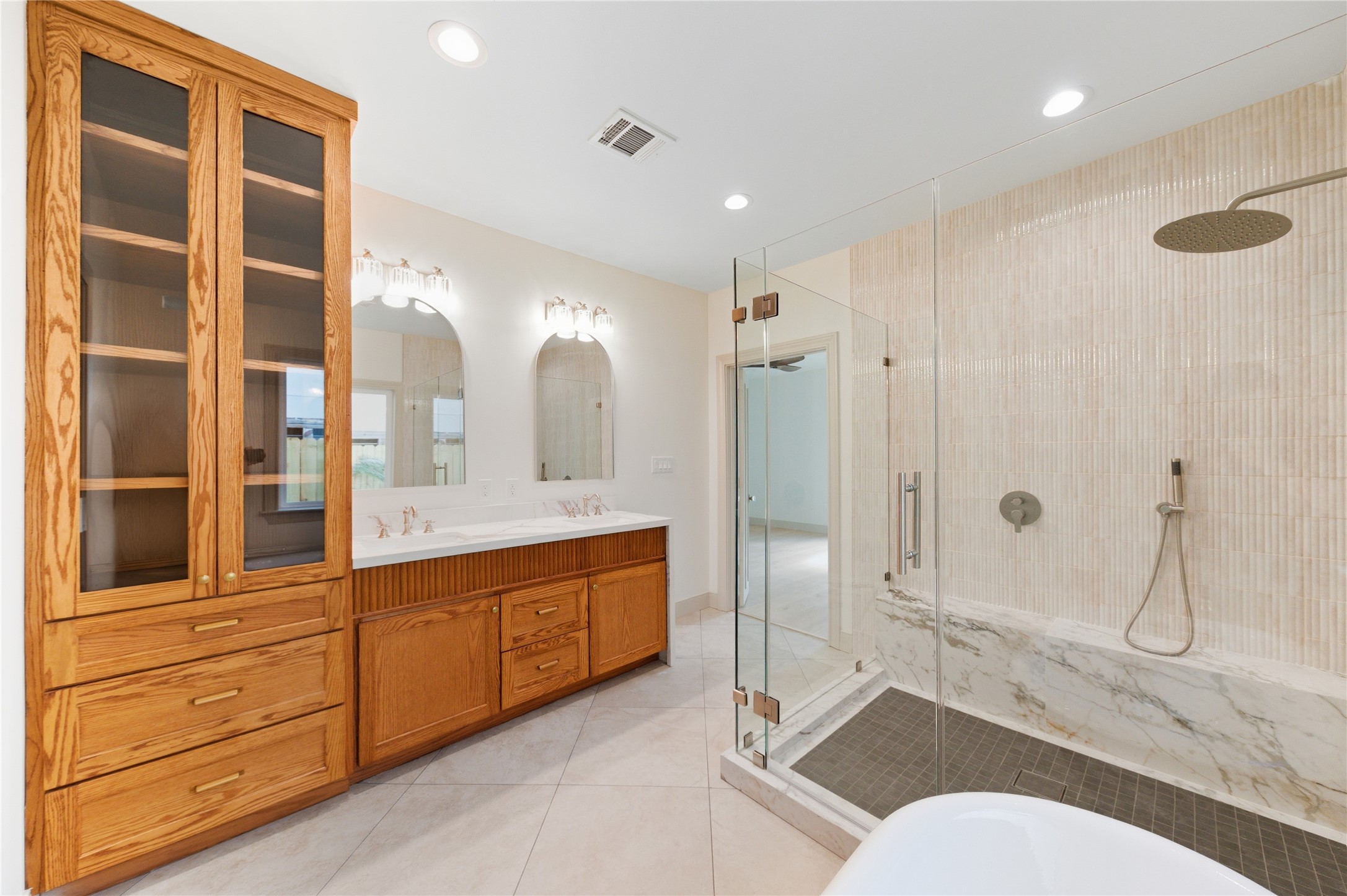1202 Aurora Street Houston, TX 77009 - Photo 31 of 37 a bathroom with a granite countertop sink mirror vanity and toilet