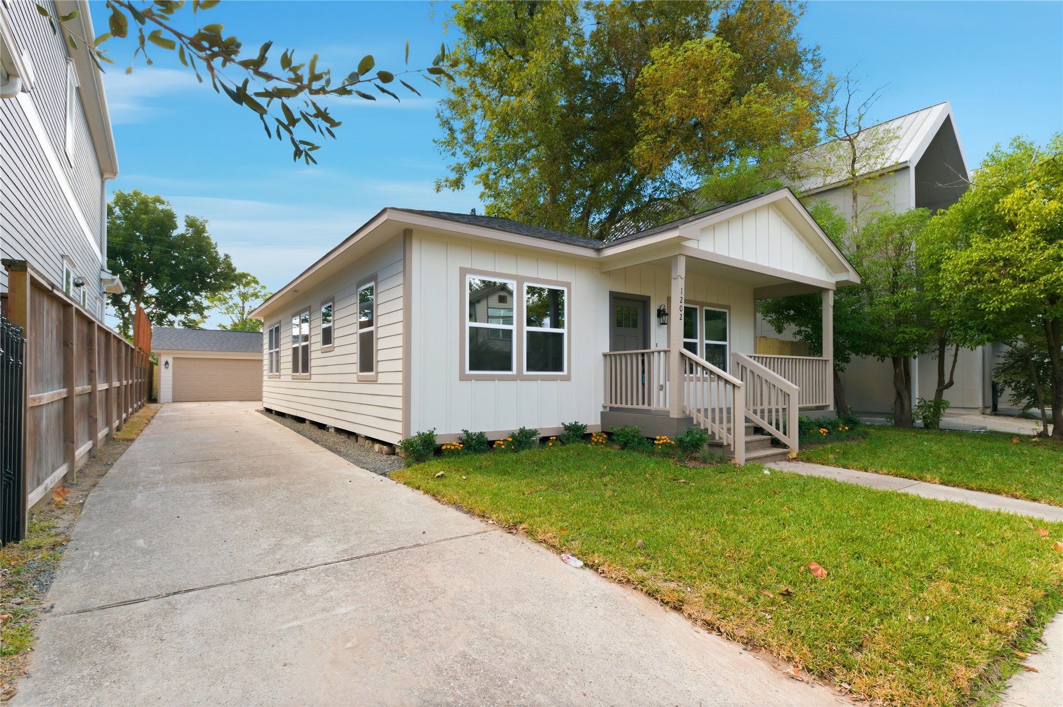1202 Aurora Street Houston, TX 77009 - Photo 4 of 37 a front view of a house with a yard