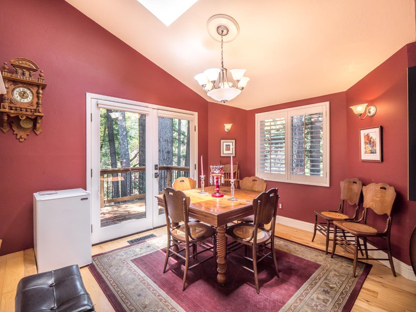 12445 Alba Road Ben Lomond, CA 95005 - Photo 21 of 37 a view of a dining room with furniture window and wooden floor