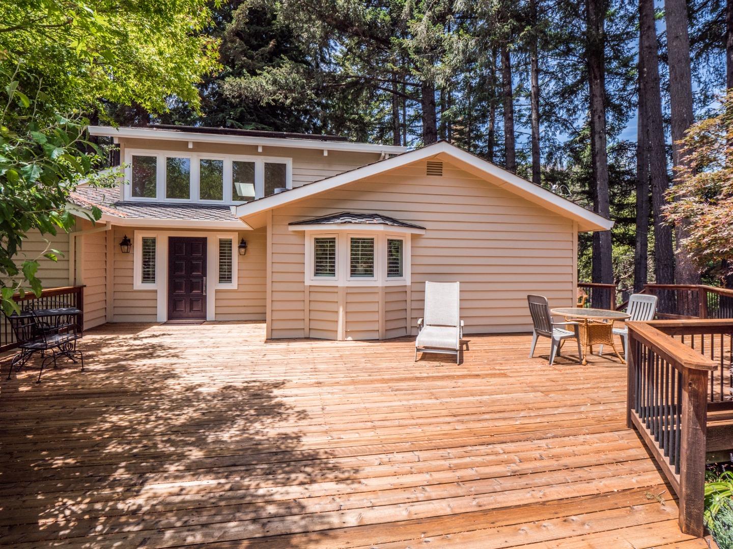 12445 Alba Road Ben Lomond, CA 95005 - Photo 3 of 37 a backyard of a house with wooden deck and seating space