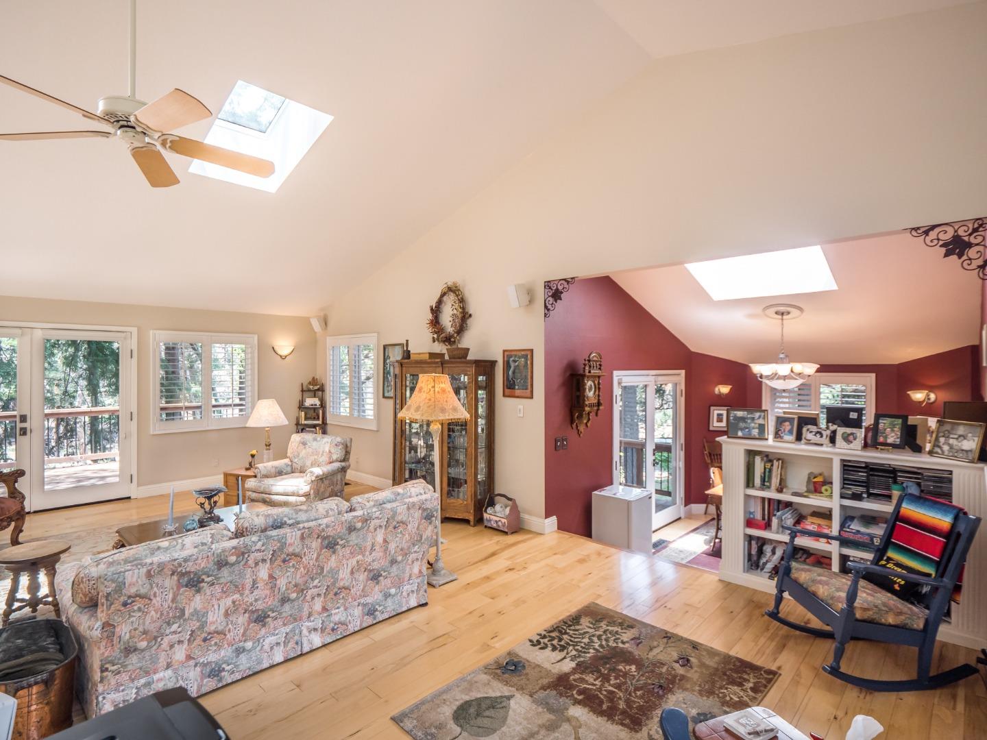 12445 Alba Road Ben Lomond, CA 95005 - Photo 10 of 37 a living room with furniture and a wooden floor