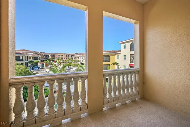 a bathroom with a granite countertop sink vanity mirror and toilet