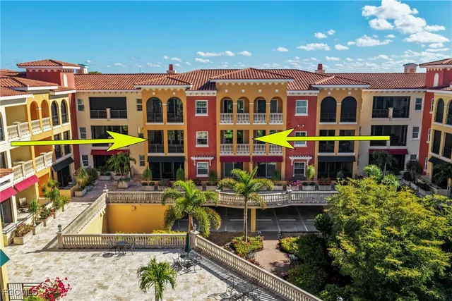 a view of kitchen with stainless steel appliances granite countertop a refrigerator and a sink