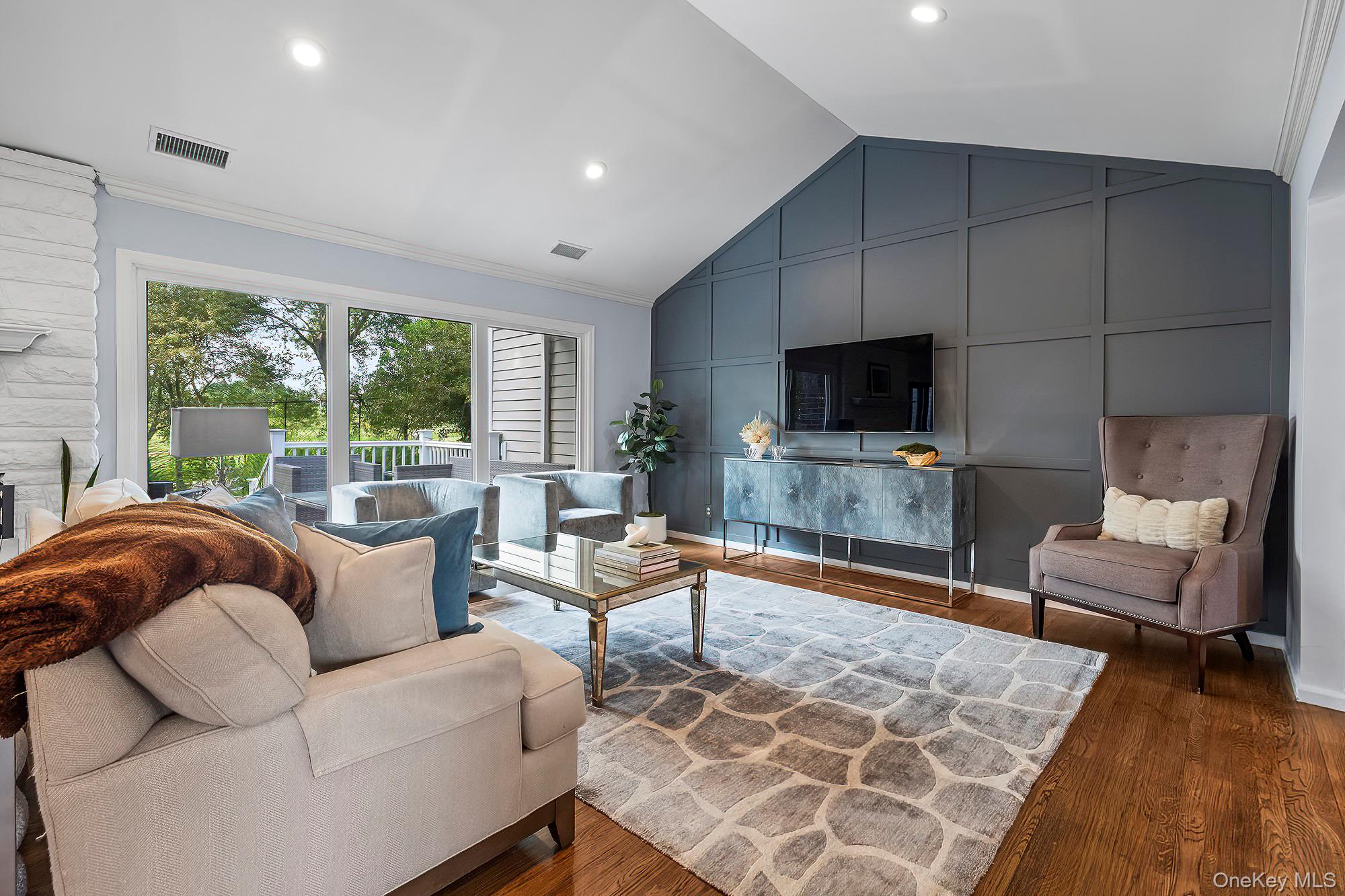53 Country Ridge Drive Rye Brook, NY 10573 - Photo 13 of 50 a living room with furniture and a fireplace