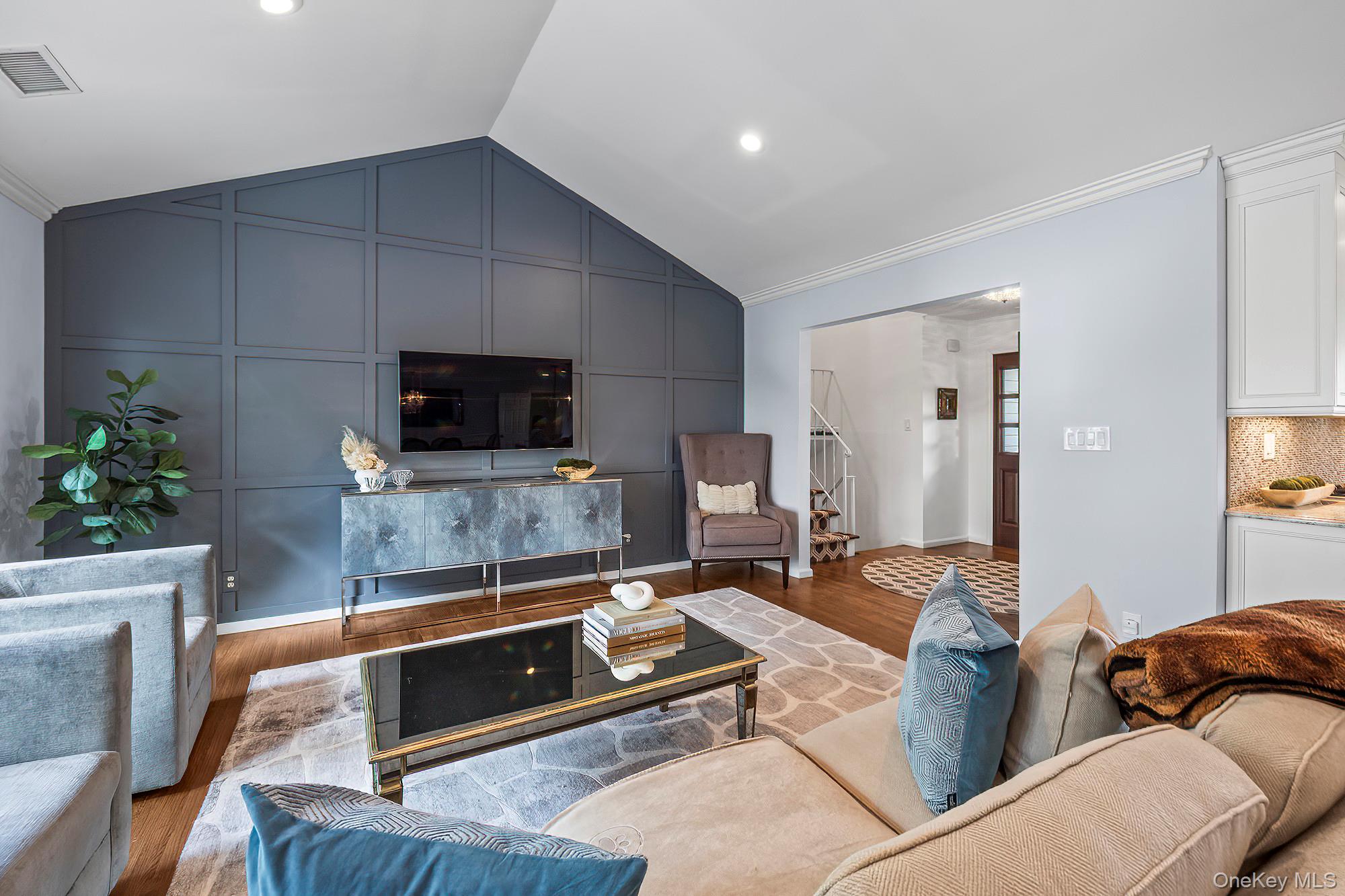 53 Country Ridge Drive Rye Brook, NY 10573 - Photo 14 of 50 a living room with furniture and a flat screen tv
