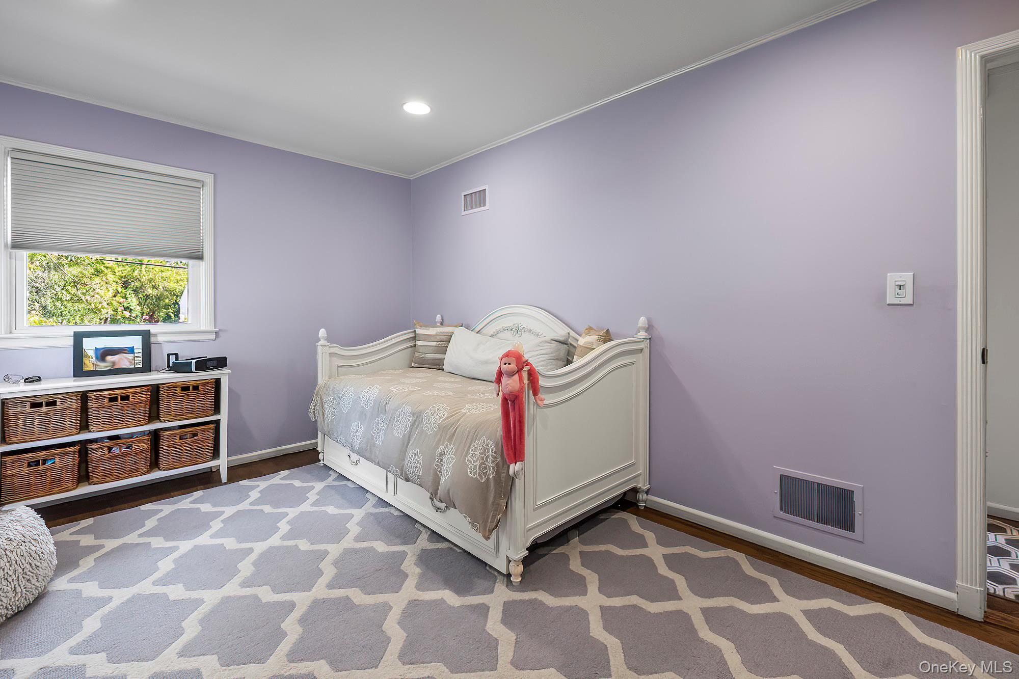 53 Country Ridge Drive Rye Brook, NY 10573 - Photo 21 of 50 a bedroom with a bed and a cabinets