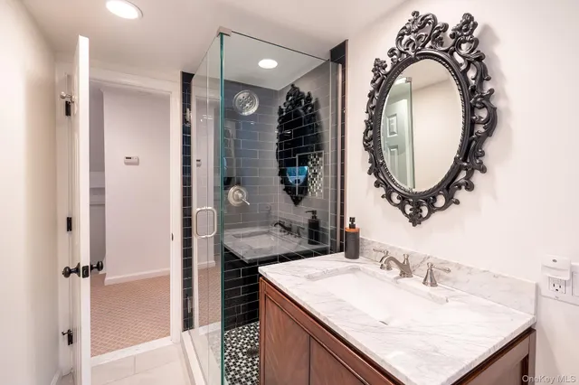 a bathroom with a sink and a mirror