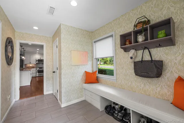 a kitchen with stainless steel appliances granite countertop a refrigerator and a stove