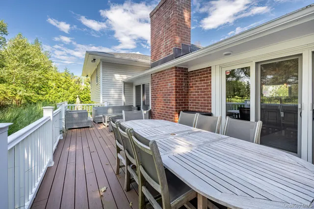 a dinning table and chairs in patio of the house