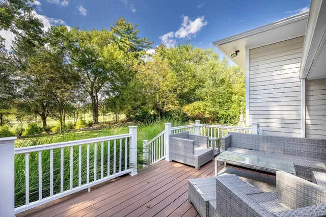 a house view with a sitting space and garden
