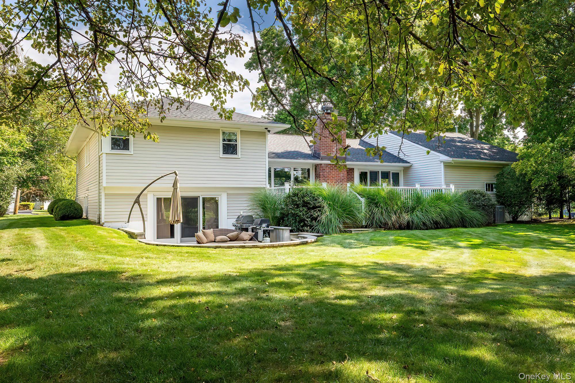53 Country Ridge Drive Rye Brook, NY 10573 - Photo 41 of 50 a front view of house with yard and green space