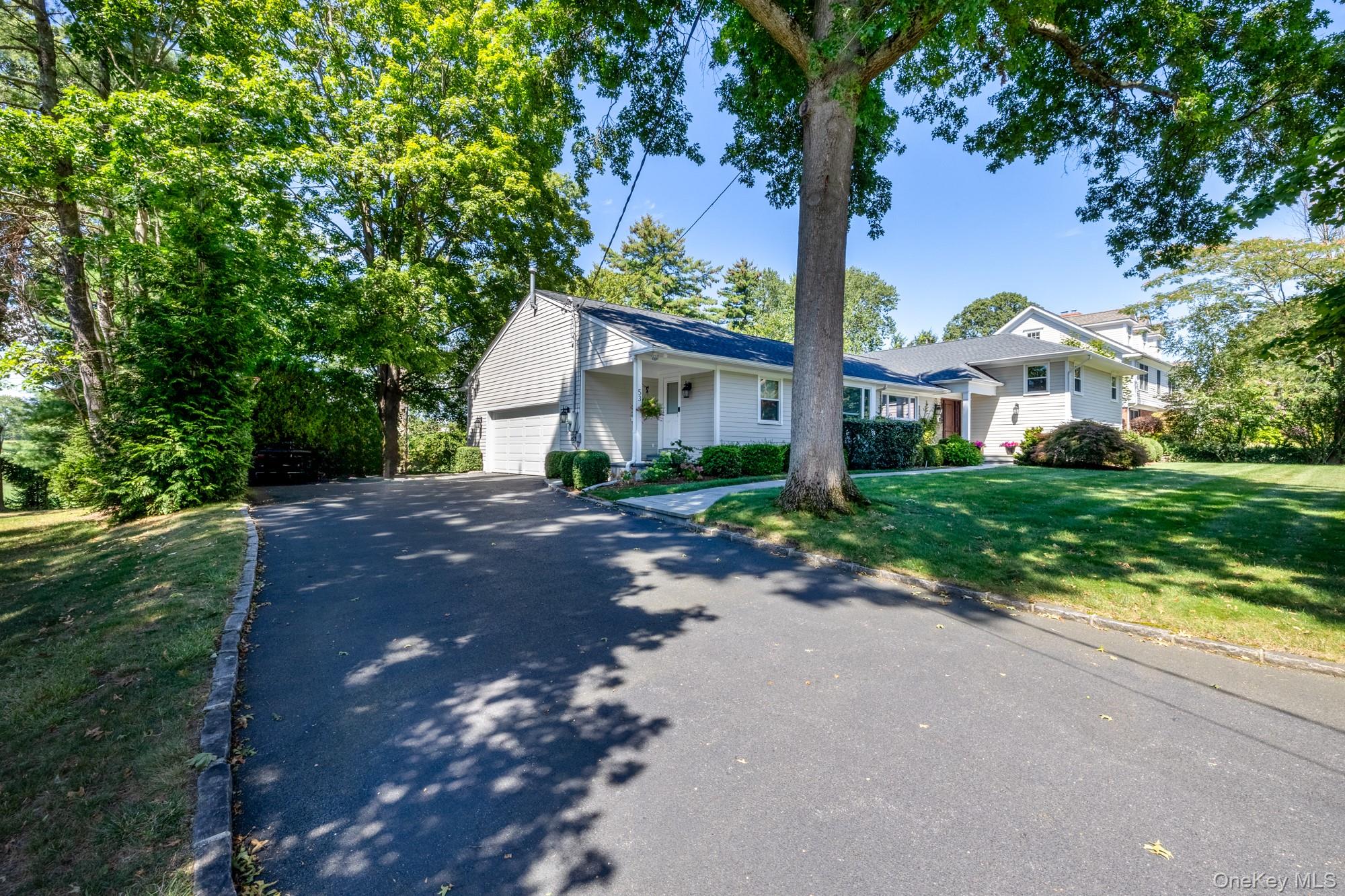 53 Country Ridge Drive Rye Brook, NY 10573 - Photo 43 of 50 a front view of house with yard and green space