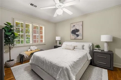 a bedroom with a large bed and a window