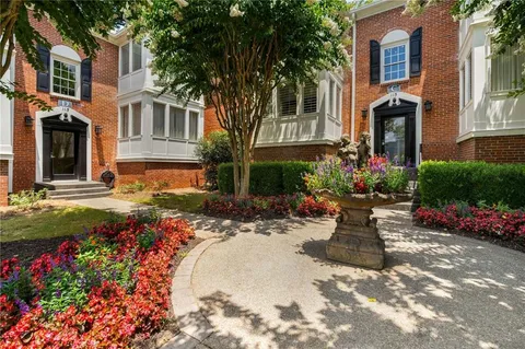 a view of a house with backyard sitting in backyard