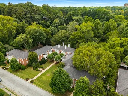 an aerial view of a house with yard