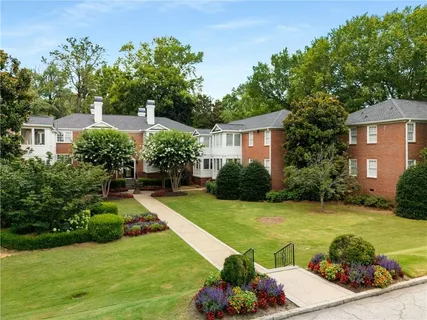 a view of a house with swimming pool garden and patio
