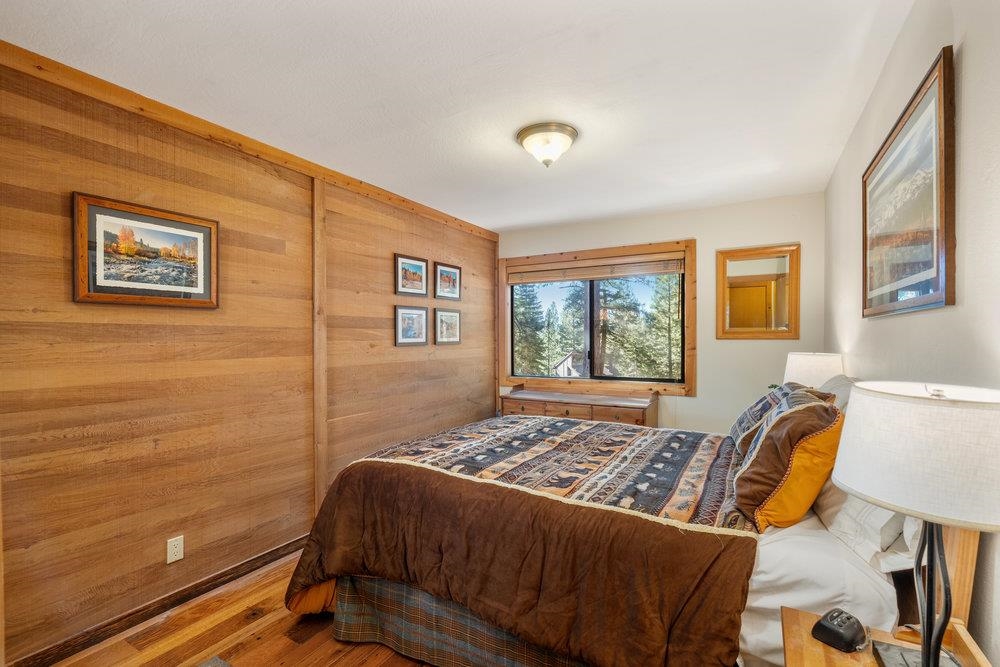 6038 Mill Camp Northstar, CA 96161 - Photo 11 of 28 a bedroom with a bed and wooden floor