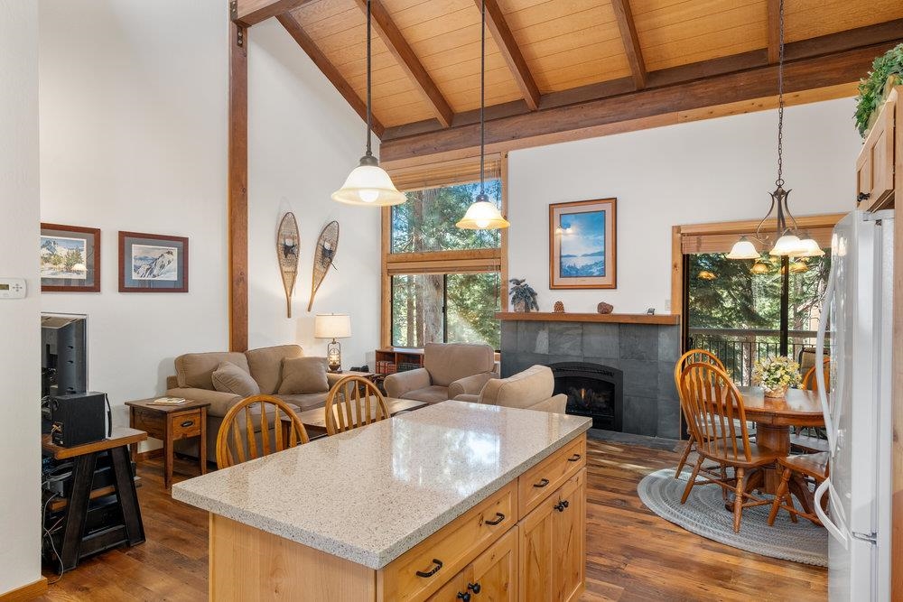 6038 Mill Camp Northstar, CA 96161 - Photo 4 of 28 a living room with furniture a rug potted plant and a large window