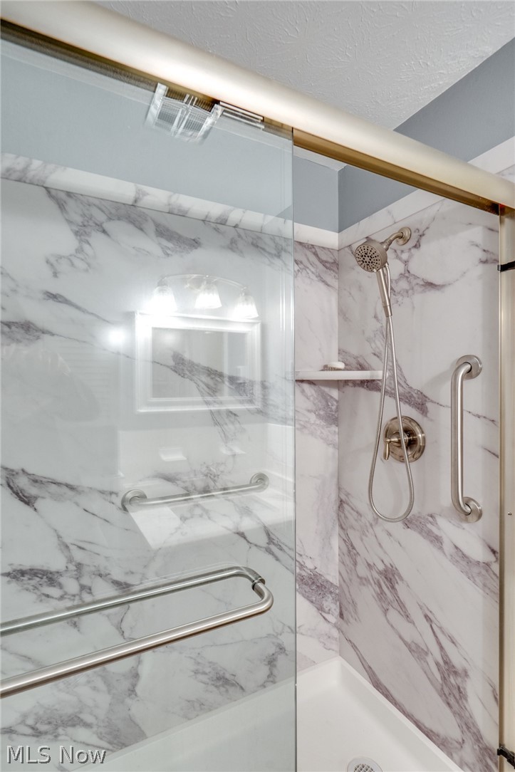 3070 Kent Road Stow, OH 44224 - Photo 38 of 43 Bathroom featuring a marble finish shower