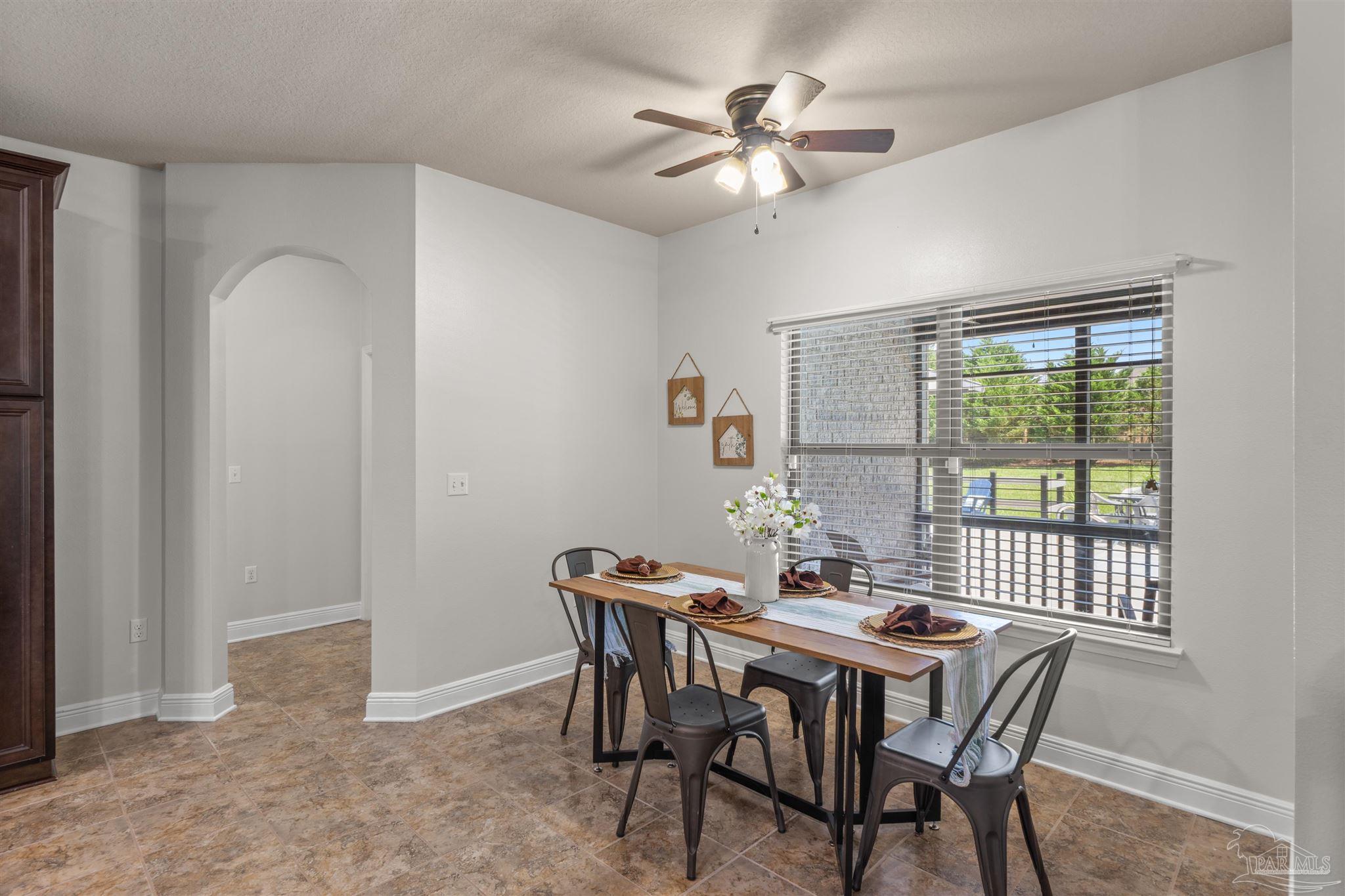 2698 Tulip Hill Road Pace, FL 32571 - Photo 20 of 65 a view of a dining room with furniture window and outside view