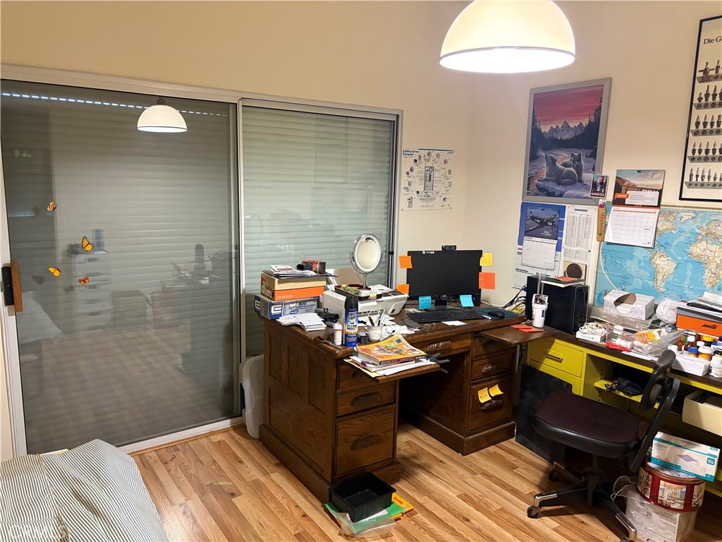 40135 Festival Road Murrieta, CA 92562 - Photo 11 of 35 a bedroom with a bed and a chandelier