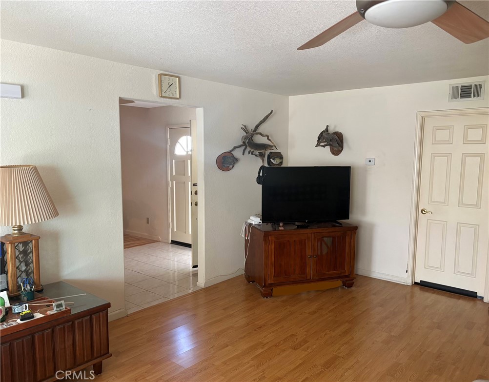 40135 Festival Road Murrieta, CA 92562 - Photo 12 of 35 a living room with furniture and a flat screen tv