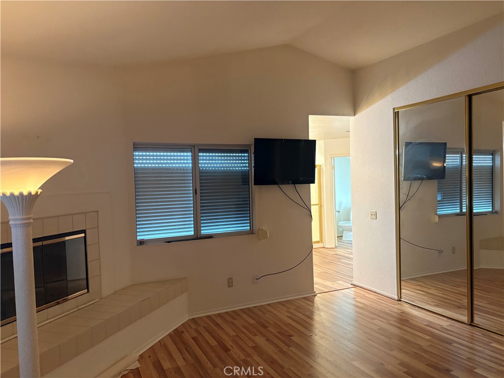 40135 Festival Road Murrieta, CA 92562 - Photo 14 of 35 a view of a livingroom with wooden floor and a fireplace