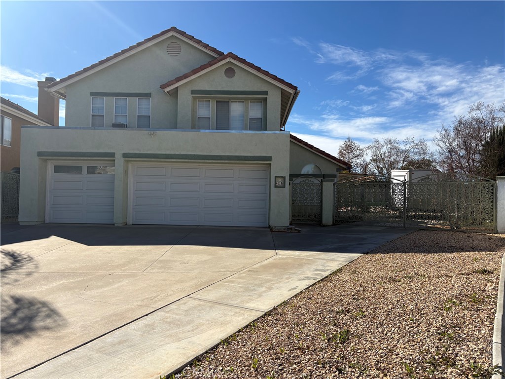 40135 Festival Road Murrieta, CA 92562 - Photo 3 of 35 a front view of a house with a yard and garage