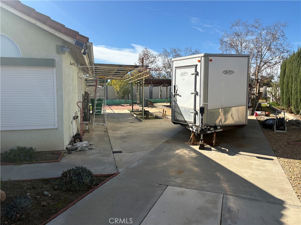 40135 Festival Road Murrieta, CA 92562 - Photo 35 of 35 a view of a patio with table and chairs potted plants