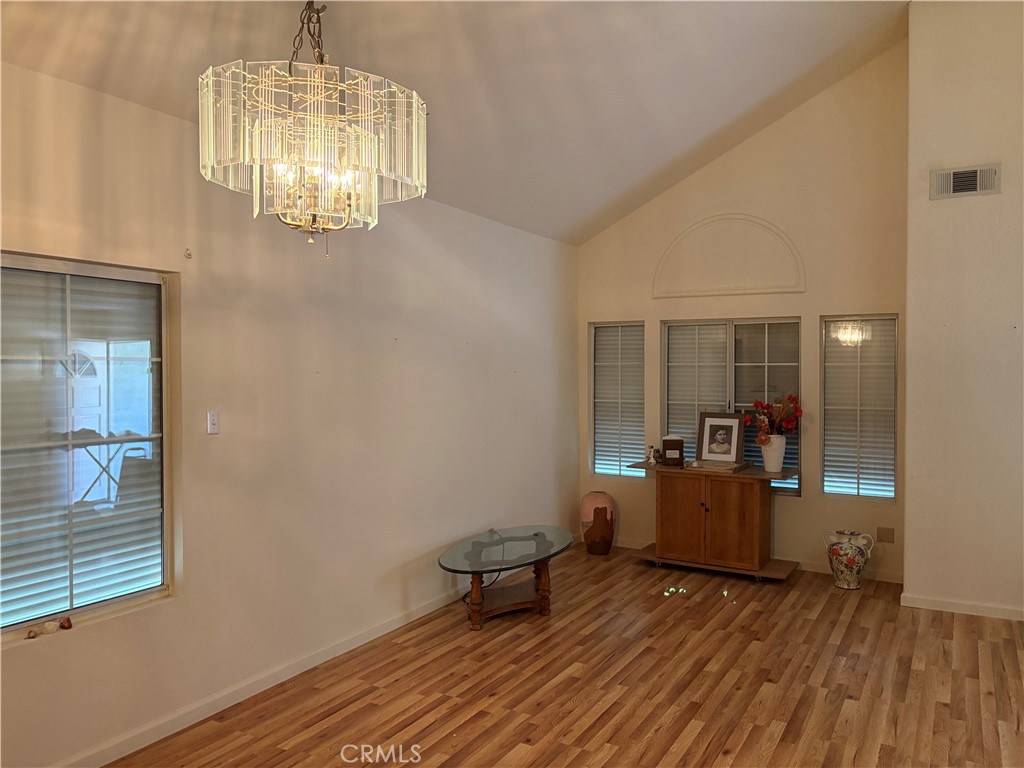 40135 Festival Road Murrieta, CA 92562 - Photo 7 of 35 a view of a room with wooden floor cabinet and windows