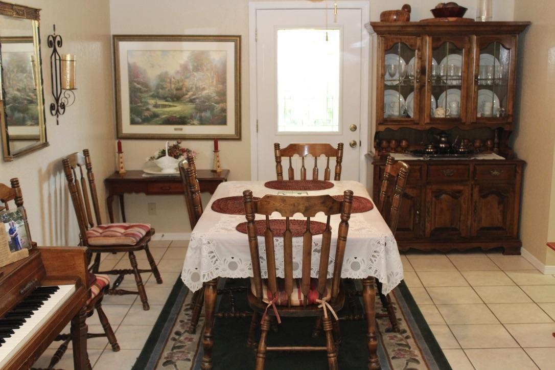 705 Valley Road Crestview, FL 32539 - Photo 8 of 20 a view of a dining room with furniture and wooden floor