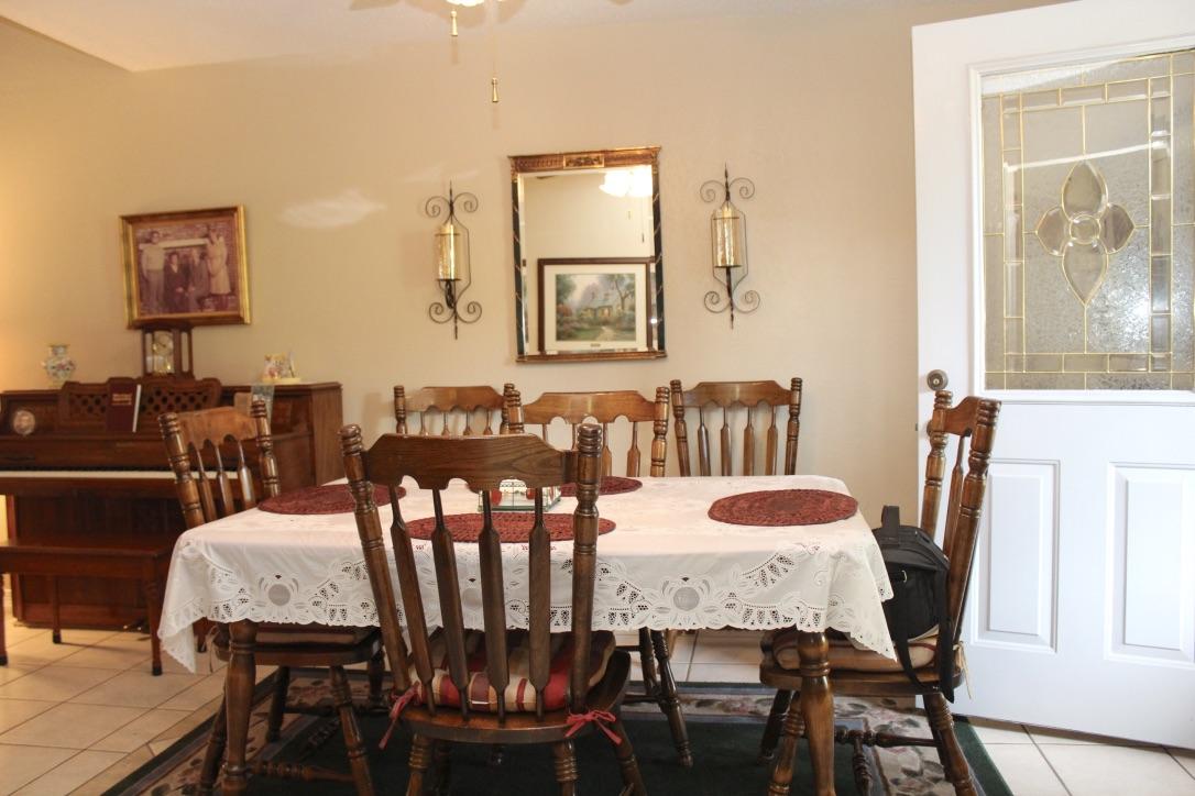 705 Valley Road Crestview, FL 32539 - Photo 9 of 20 a view of a dining room with furniture and wooden floor