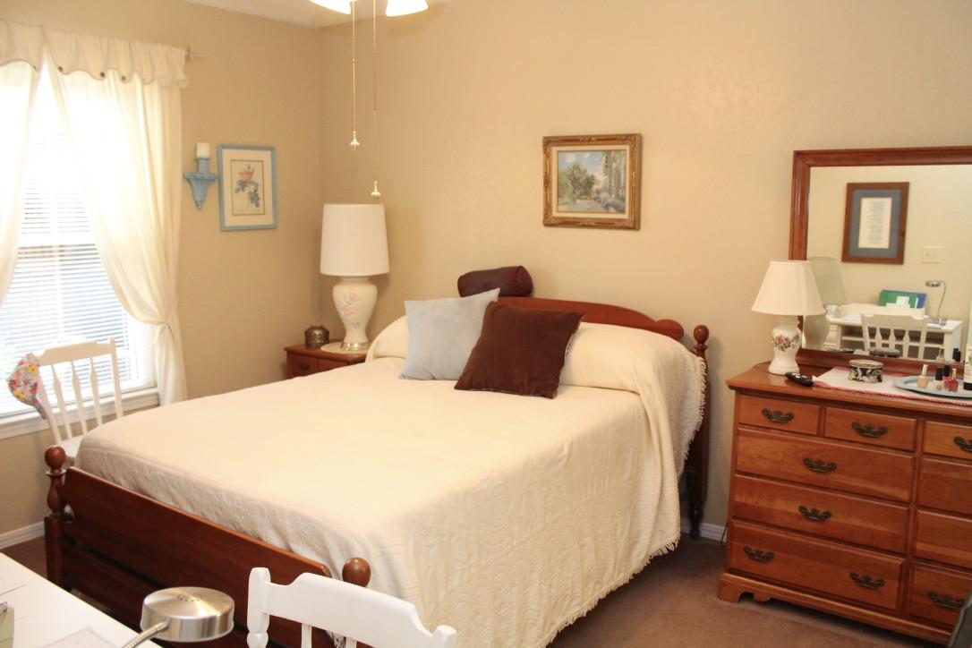 705 Valley Road Crestview, FL 32539 - Photo 10 of 20 a bedroom with a bed and a dresser