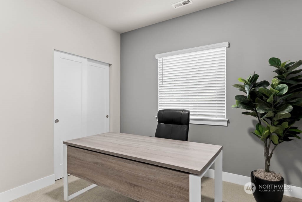 22825 20th Place West Bothell, WA 98021 - Photo 16 of 35 a bedroom with a table and a potted plant