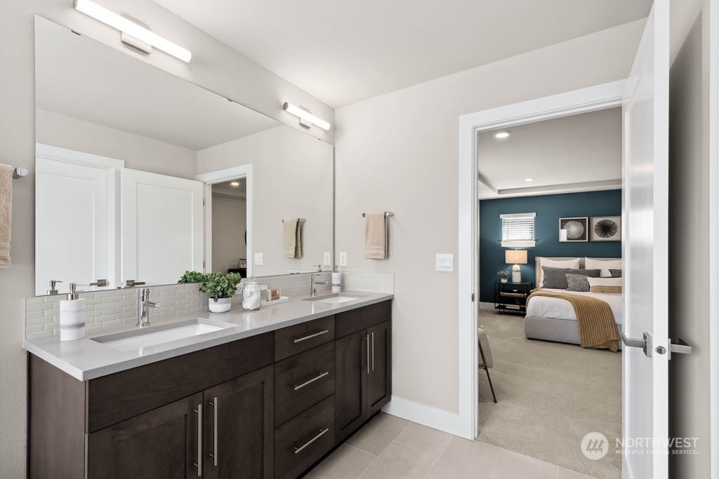 22825 20th Place West Bothell, WA 98021 - Photo 25 of 35 a en suite bathroom with a double vanity sink and a mirror