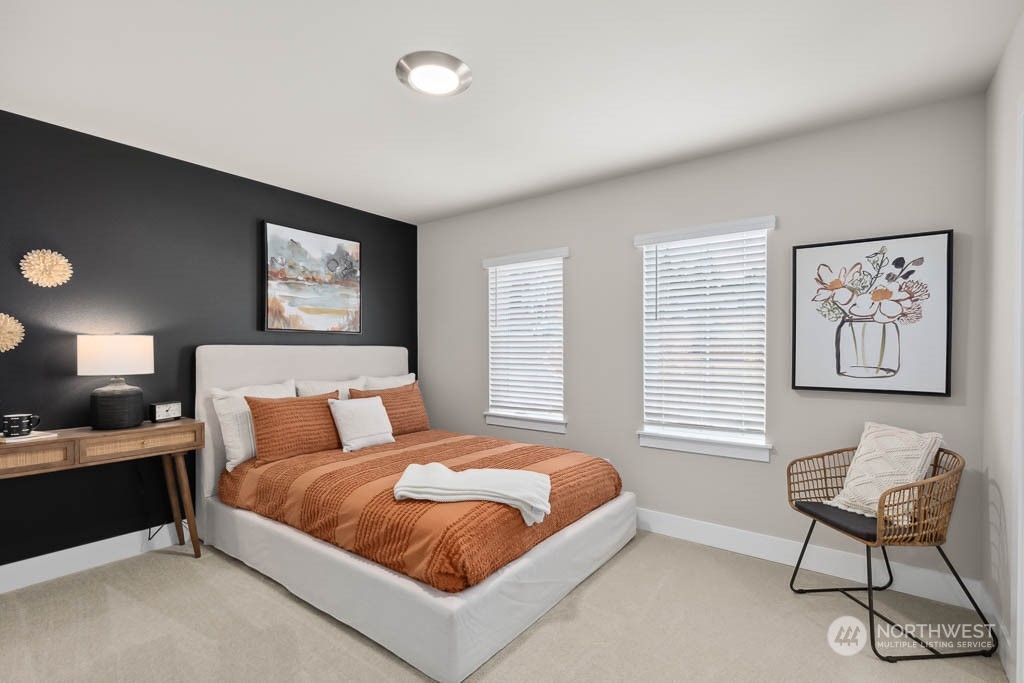 22825 20th Place West Bothell, WA 98021 - Photo 27 of 35 a bedroom with a bed and chair