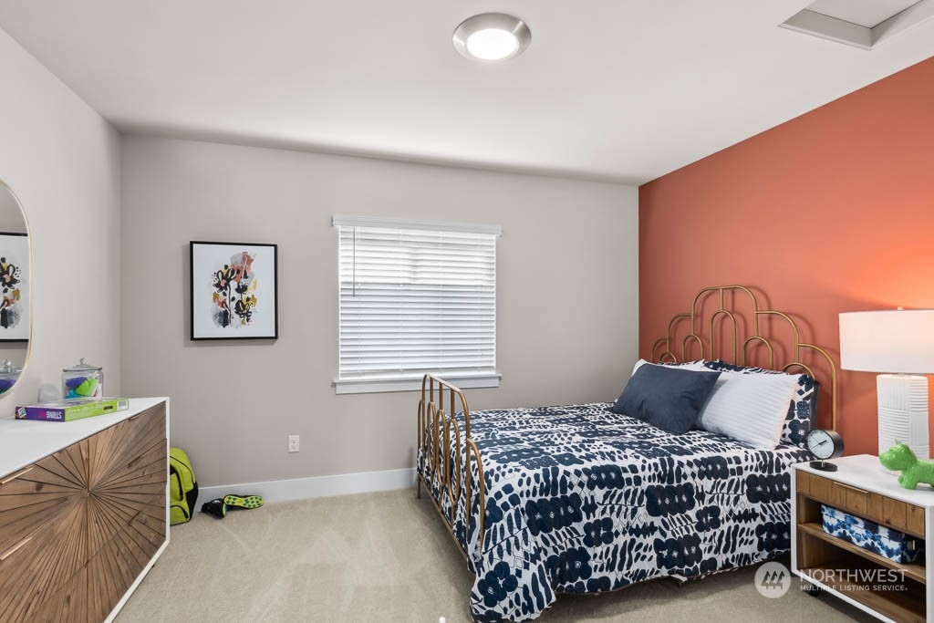 22825 20th Place West Bothell, WA 98021 - Photo 28 of 35 a bedroom with a bed and a lamp on the dresser