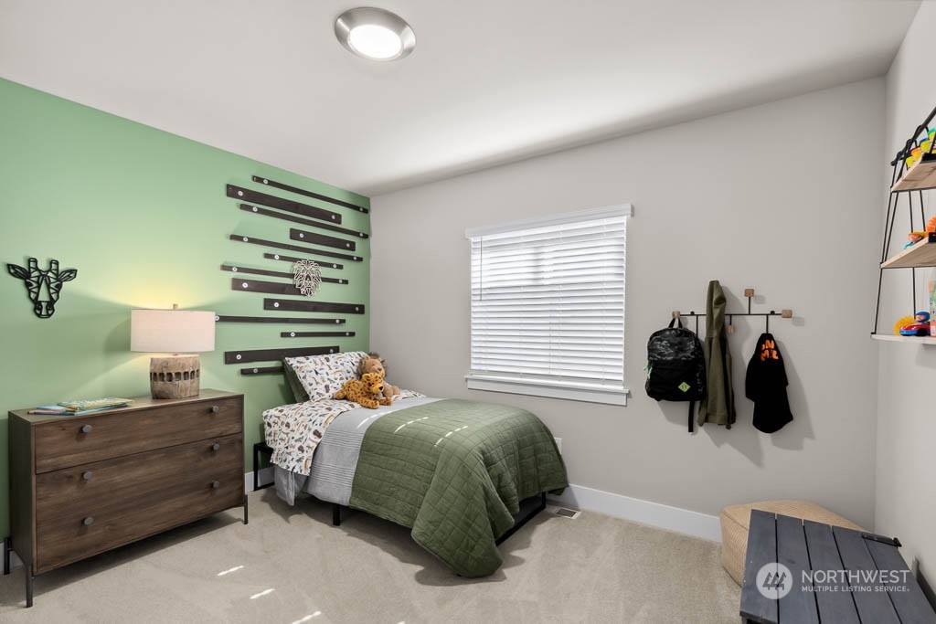 22825 20th Place West Bothell, WA 98021 - Photo 29 of 35 a bedroom with a bed and cabinets