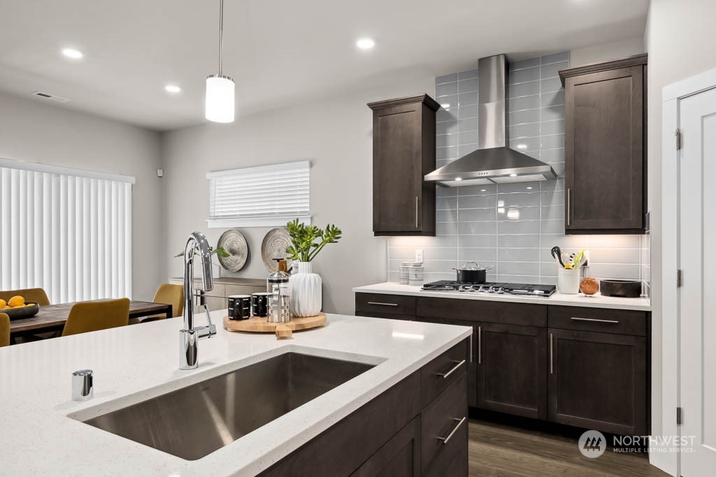 22825 20th Place West Bothell, WA 98021 - Photo 6 of 35 a kitchen that has a sink and a stove in it