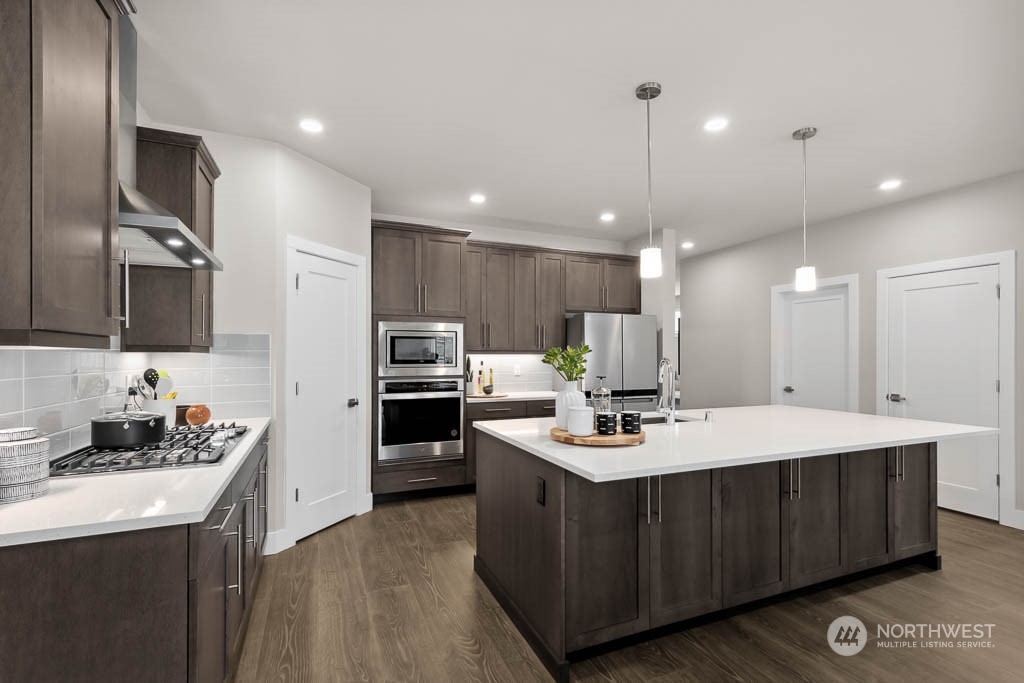 22825 20th Place West Bothell, WA 98021 - Photo 9 of 35 a kitchen with a sink stainless steel appliances and counter space