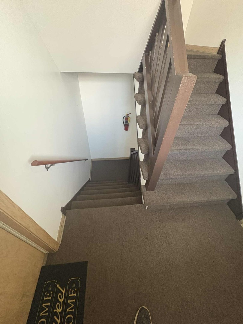 8000 South Pulaski Road, Unit 201 Chicago, IL 60652 - Photo 4 of 9 a view of staircase with white walls