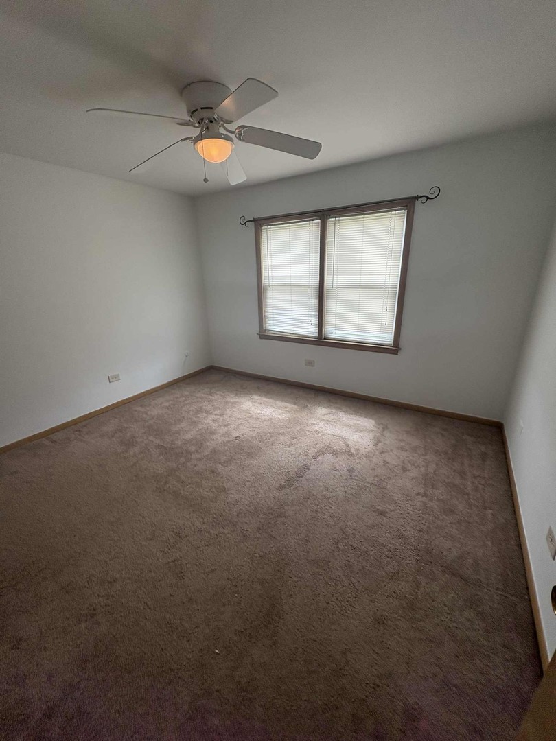 8000 South Pulaski Road, Unit 201 Chicago, IL 60652 - Photo 7 of 9 an empty room with a window