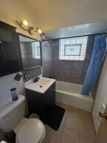 a bathroom with a sink a toilet and a bathtub