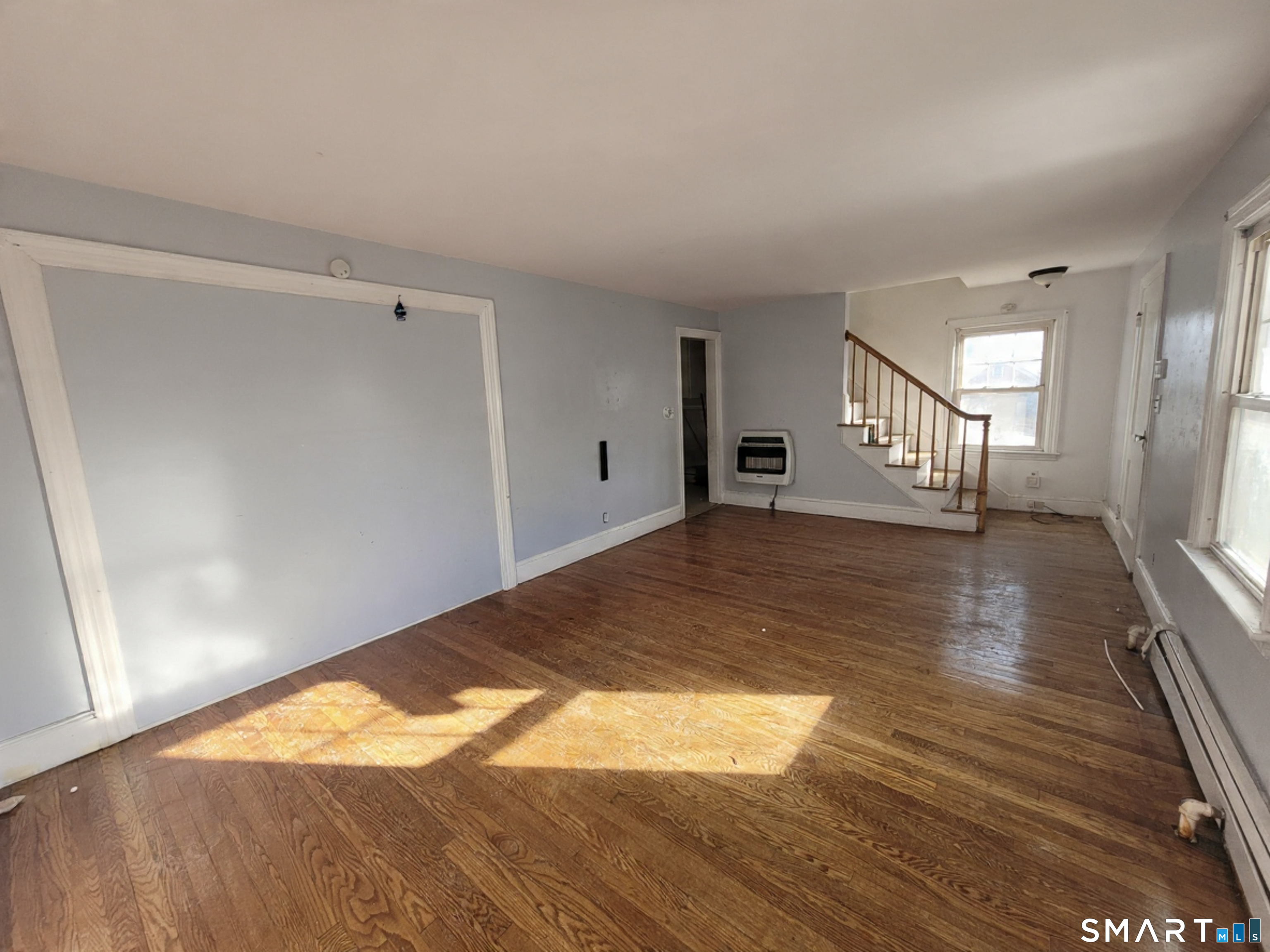 96 Tudor Street Waterbury, CT 06704 - Photo 4 of 15 a view of empty room with wooden floor