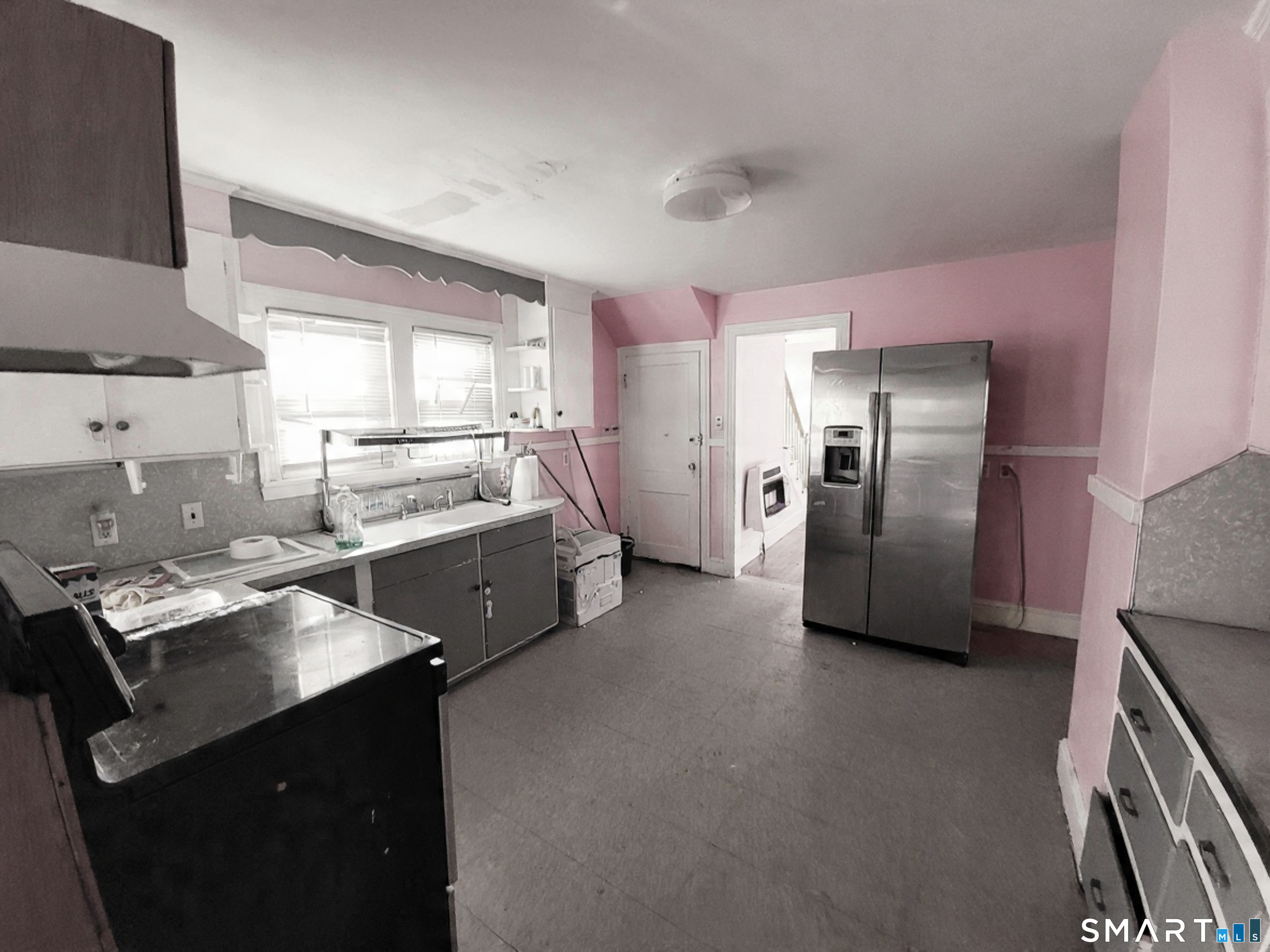 96 Tudor Street Waterbury, CT 06704 - Photo 5 of 15 a kitchen with stainless steel appliances a refrigerator a stove a sink and a refrigerator